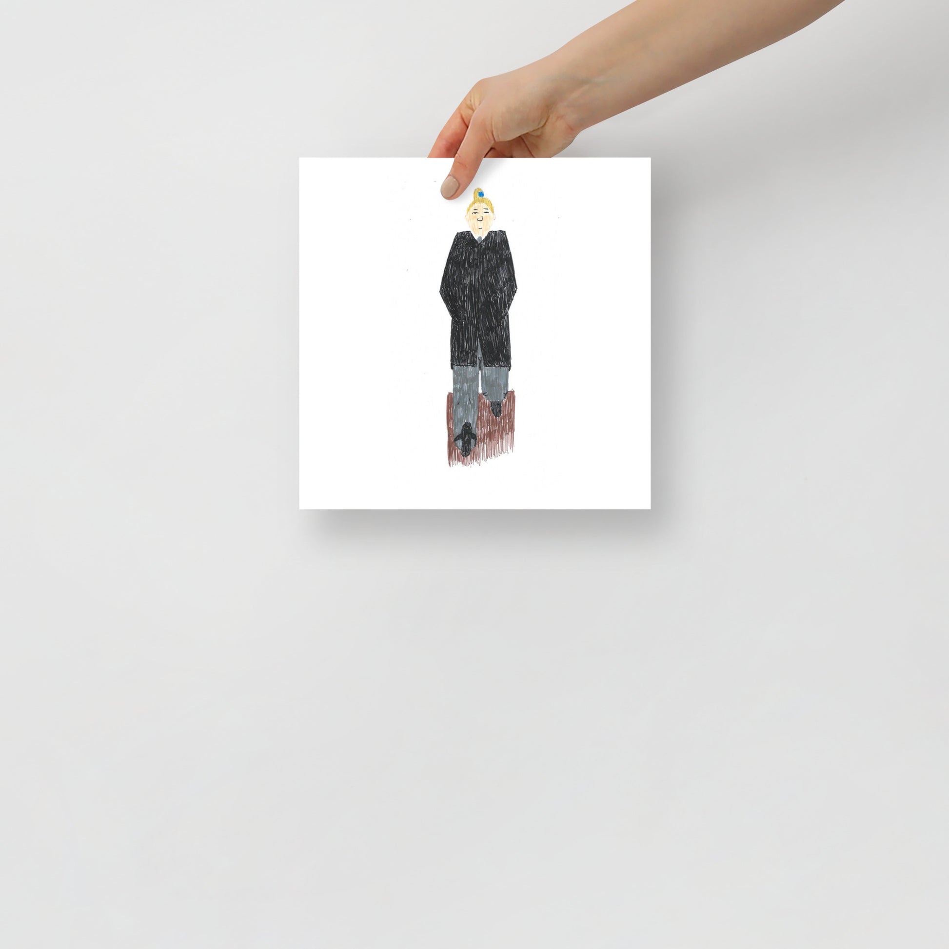 This image shows an art print of a square artwork  depicting a person in a black coat and blue pants on a white background. The mood is minimalist and thoughtful.
