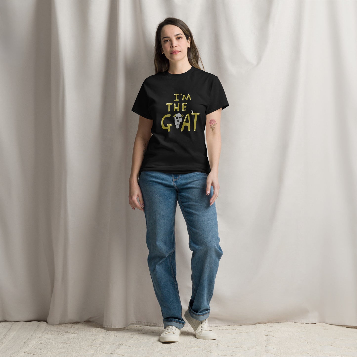 This image shows a black graphic t-shirt featuring the phrase "I'm the Goat