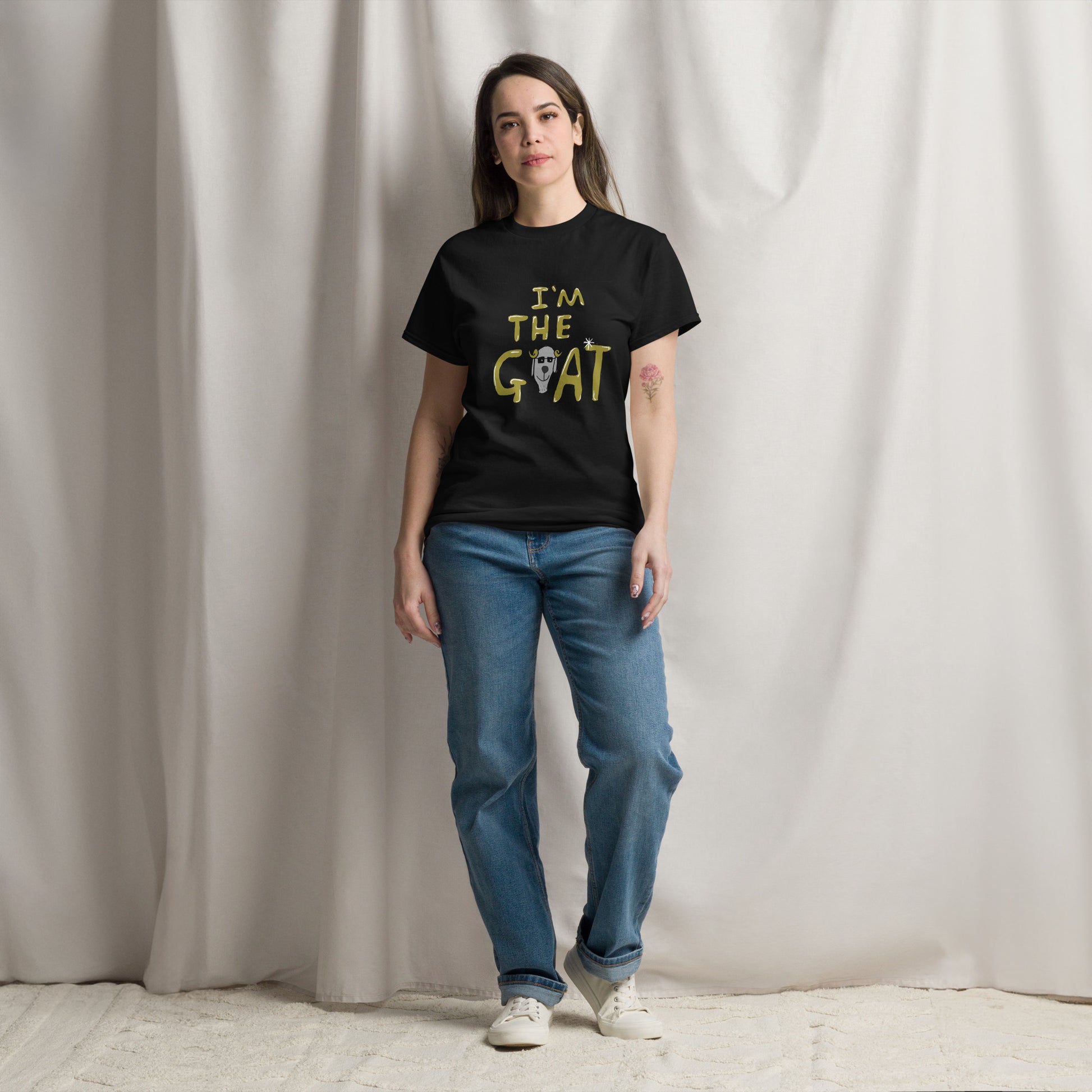 This image shows a black graphic t-shirt featuring the phrase "I'm the Goat