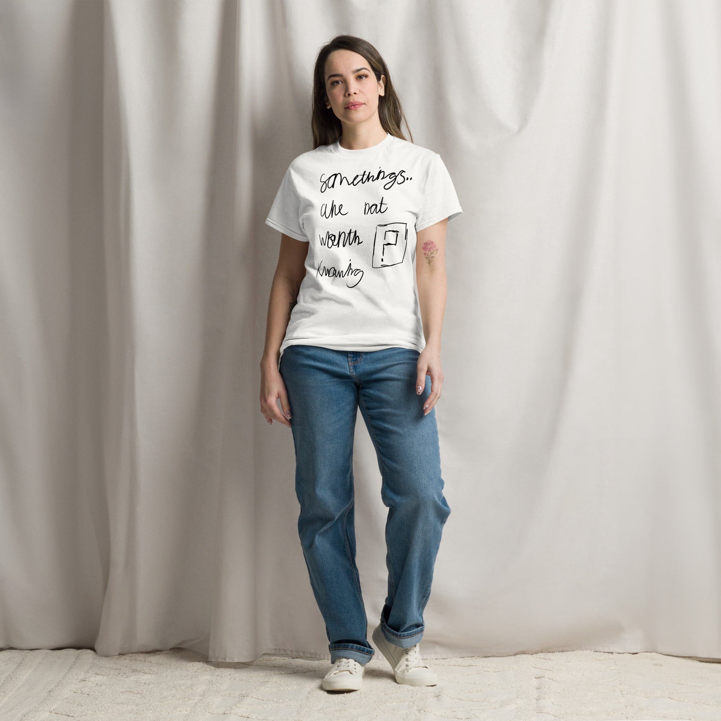 This image shows a white graphic t-shirt featuring the phrase "Somethings are not worth knowing