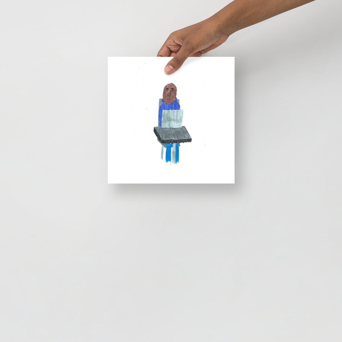 This image shows an art print of a square artwork featuring a simple, colorful figure using a laptop. The background is white, creating a minimalist and modern tone.